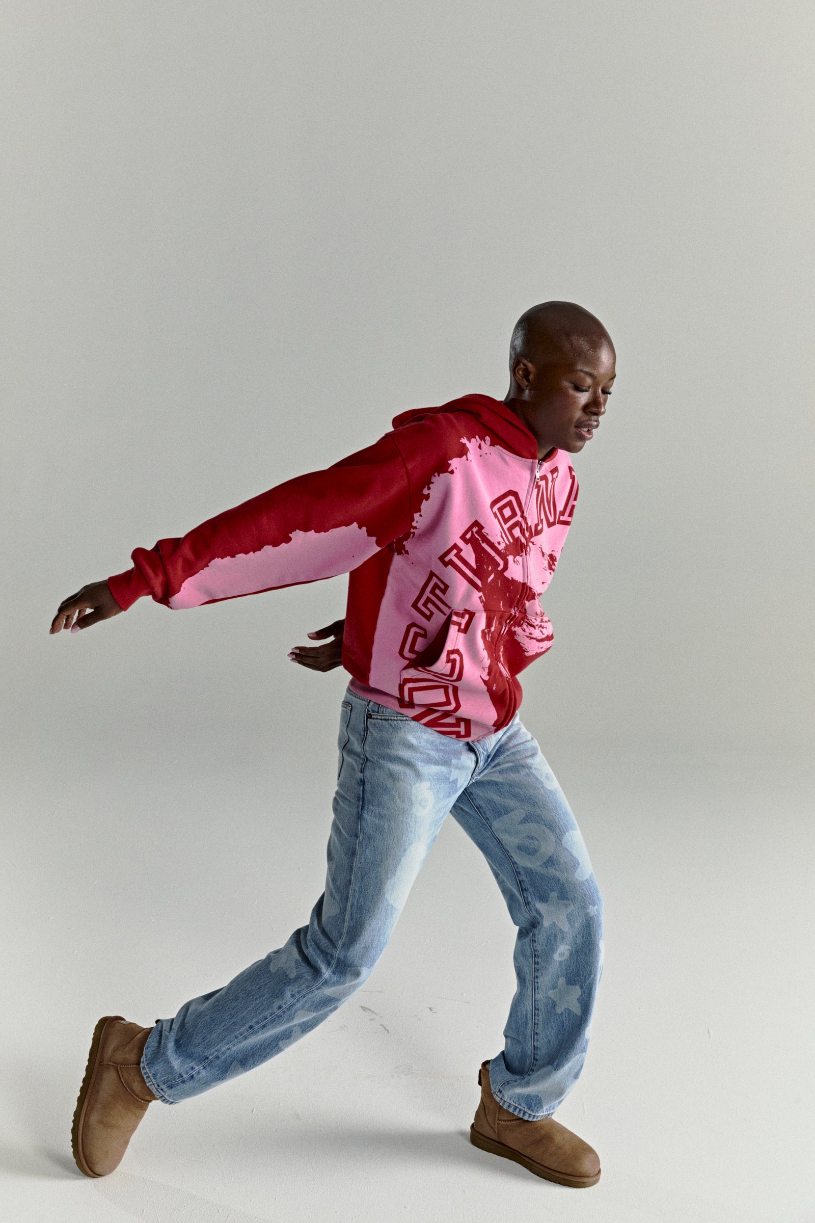 NOCTURNAL ZIP HOODIE: Color-blocked red and pink 13oz cotton fleece hoodie with varsity arch lettering.