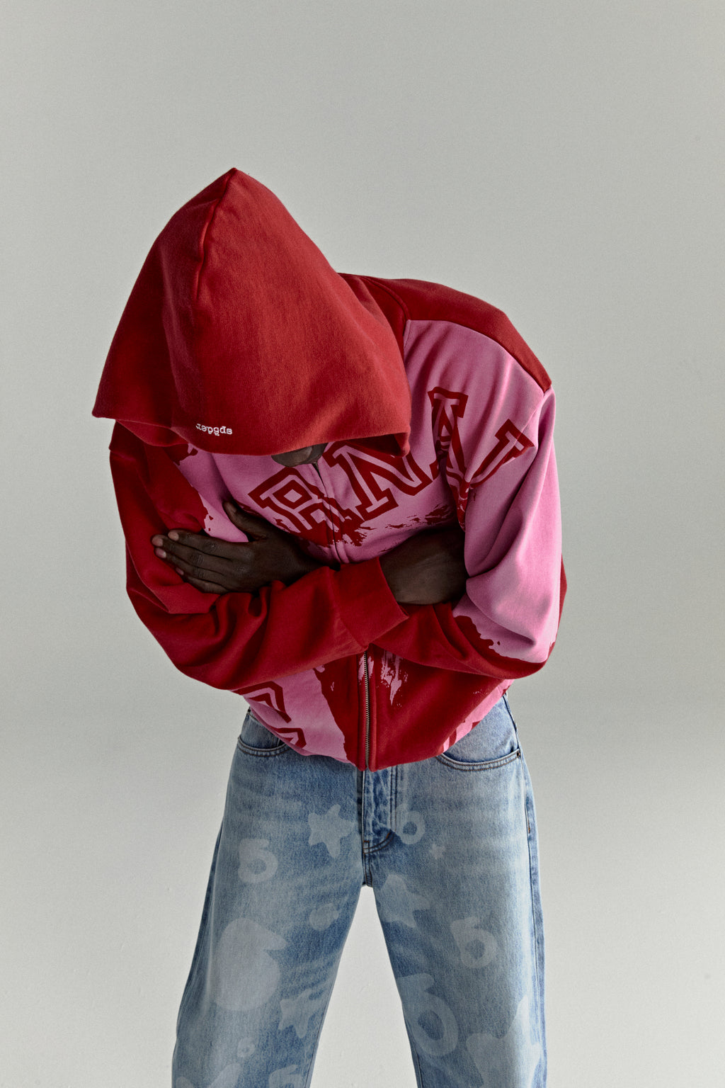 NOCTURNAL ZIP HOODIE: Red and pink color-blocked 13oz cotton fleece hoodie with varsity lettering.