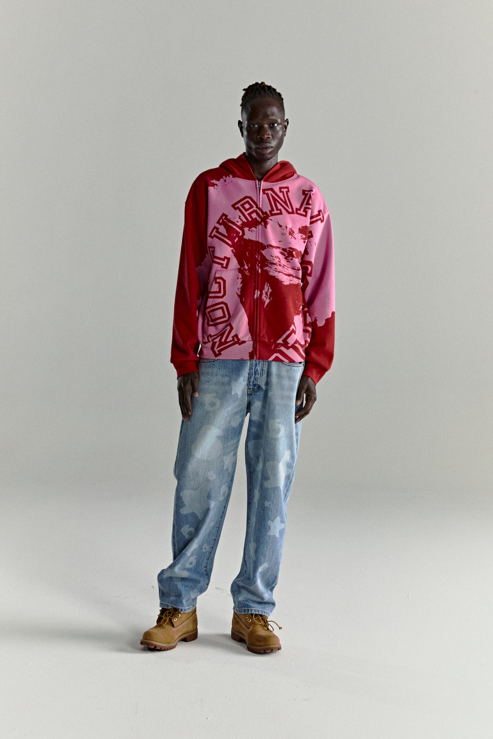 NOCTURNAL ZIP HOODIE: Color-blocked red and pink 13oz cotton fleece hoodie with varsity lettering.