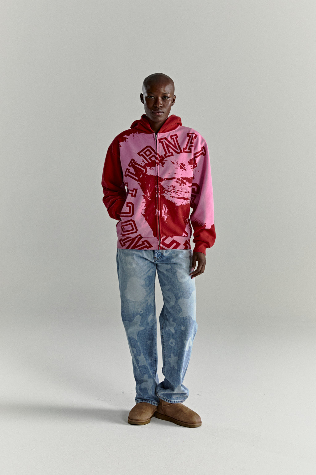 NOCTURNAL ZIP HOODIE: Color-blocked red and pink 13oz cotton fleece hoodie with varsity lettering.
