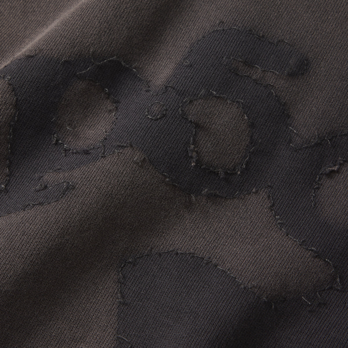 Dark grey 100% cotton fleece hoodie featuring a distressed SP5DER graphic print and star design with raw-edge applique details.