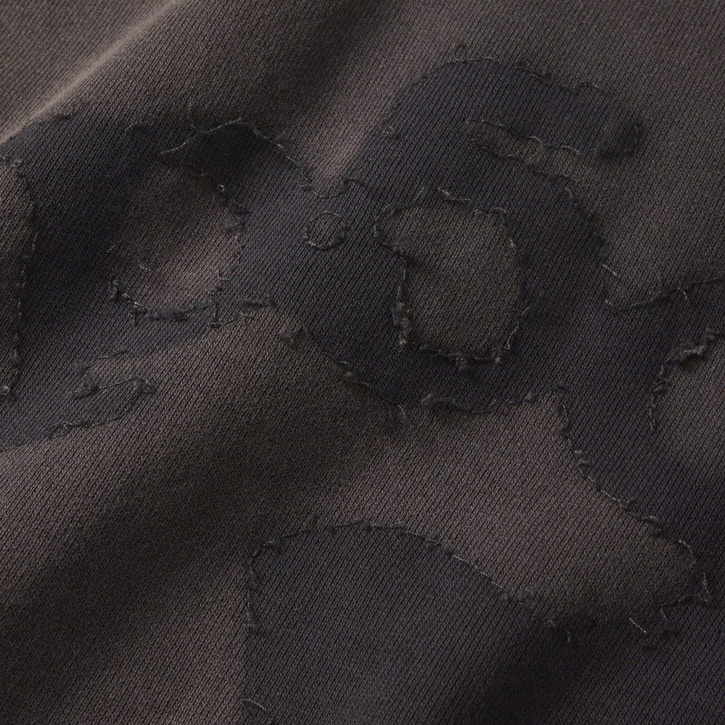 Dark grey 100% cotton fleece hoodie featuring a distressed SP5DER graphic print and star design with raw-edge applique details.