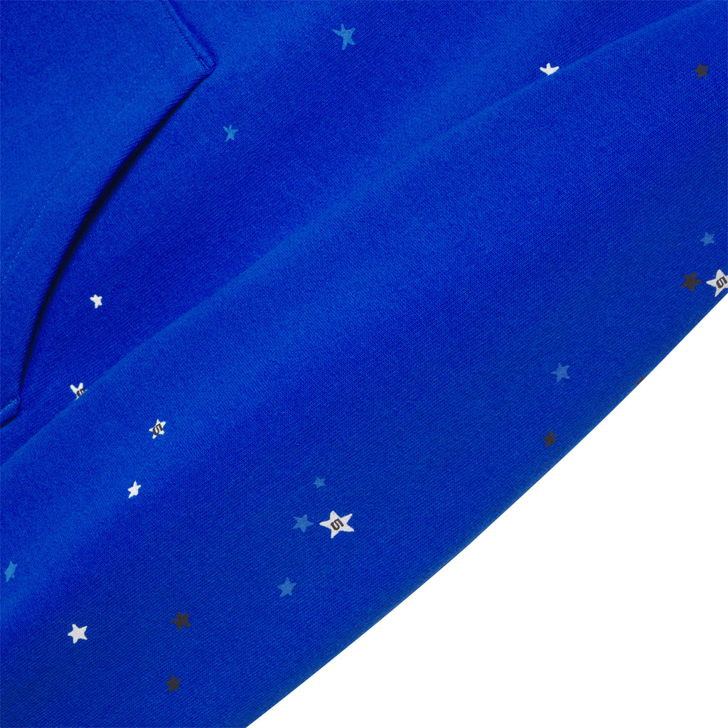 Blue cotton fleece hoodie with scattered star puff print and discharge print.
