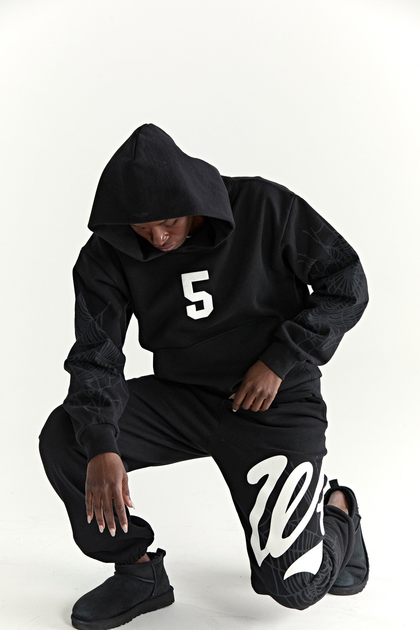 Black 13oz cotton fleece hoodie with white '5' graphic, web detail sleeves, and matching sweatpants.