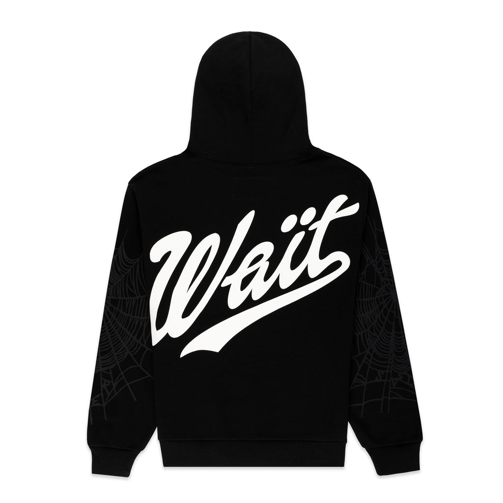 Black 13oz cotton fleece hoodie with "Wait" script text on back and subtle spider web details on sleeves.