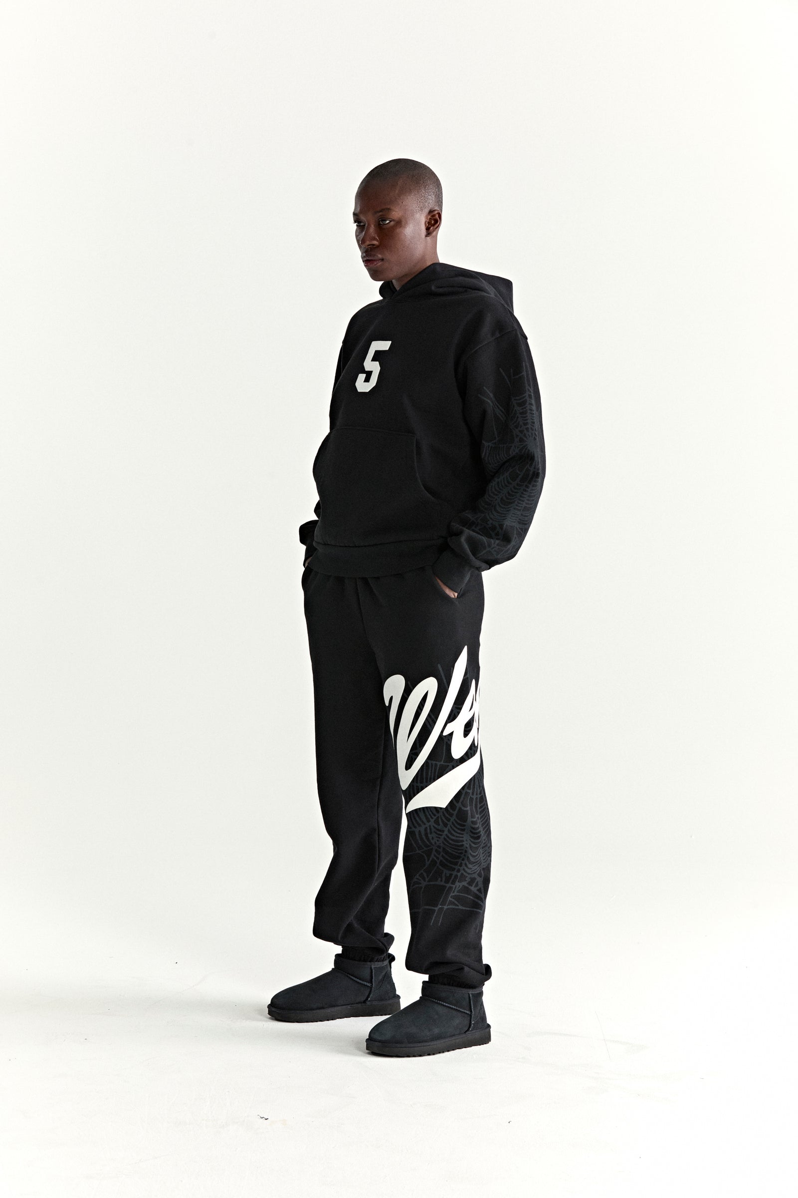 Black 13oz cotton fleece STADIUM HOODIE with white '5' graphic, web detail sleeves, and matching sweatpants.