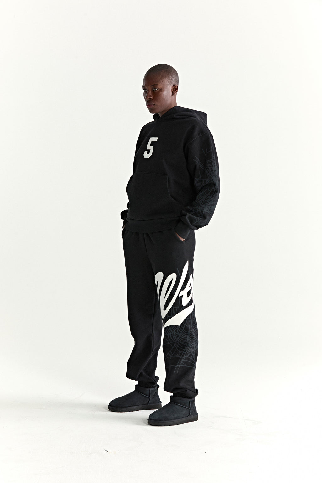 Black 13oz cotton fleece STADIUM HOODIE with white '5' graphic, web detail sleeves, and matching sweatpants.