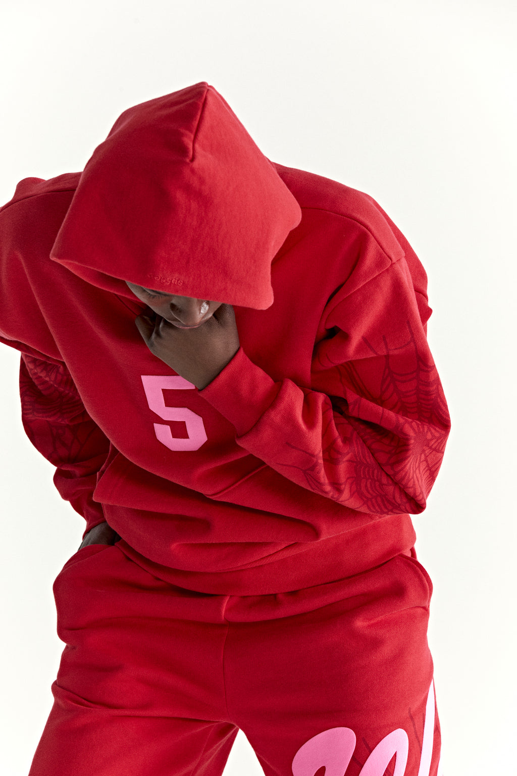 Red 13oz cotton fleece hoodie with pink '5' graphic, web detail sleeves, and matching sweatpants.