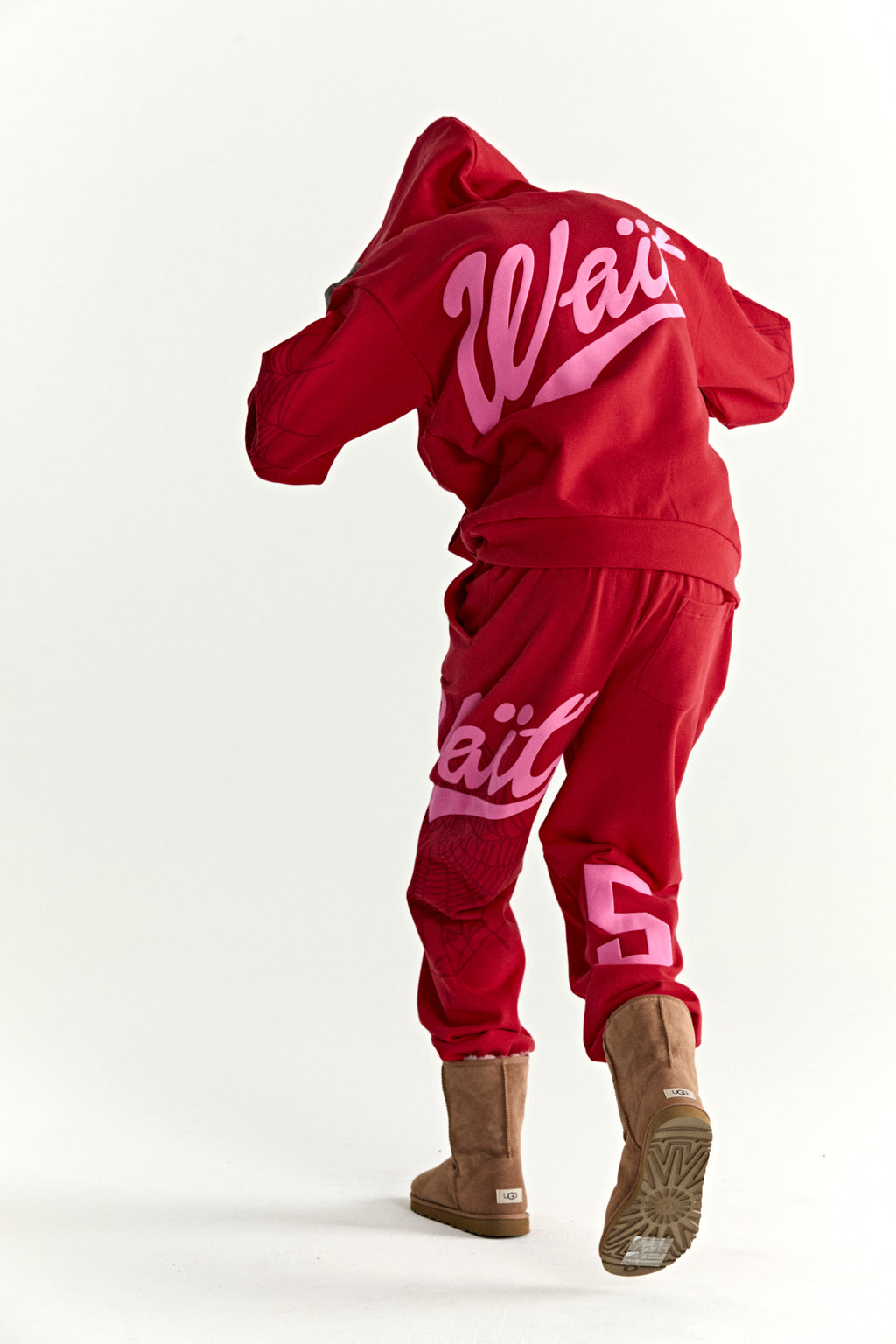 Red 13oz cotton fleece hoodie and sweatpants with pink "Wait" puff print, web detail, and '5' graphic.