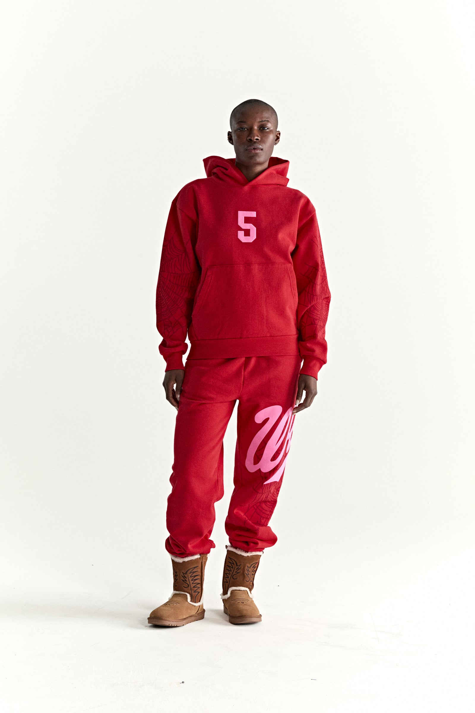 Red 13oz cotton fleece STADIUM HOODIE with pink '5' graphic, web detail sleeves, and matching sweatpants.