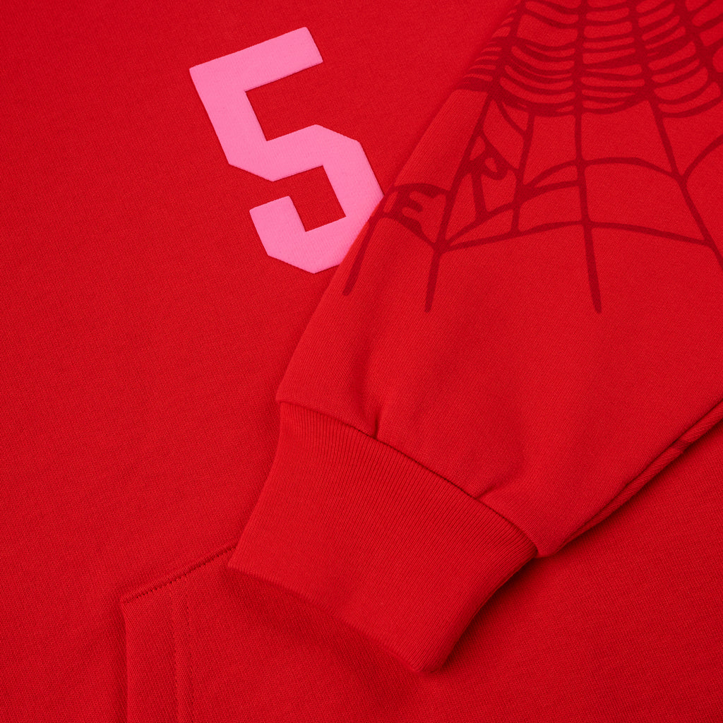 Red 13oz cotton fleece hoodie with pink '5' graphic, web detail on sleeve, and ribbed cuff.