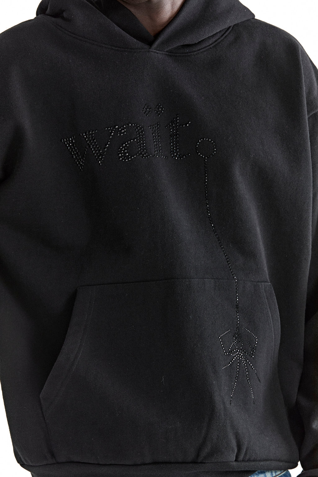 Black cotton fleece hoodie with rhinestone "Wait" text and dangling spider design.