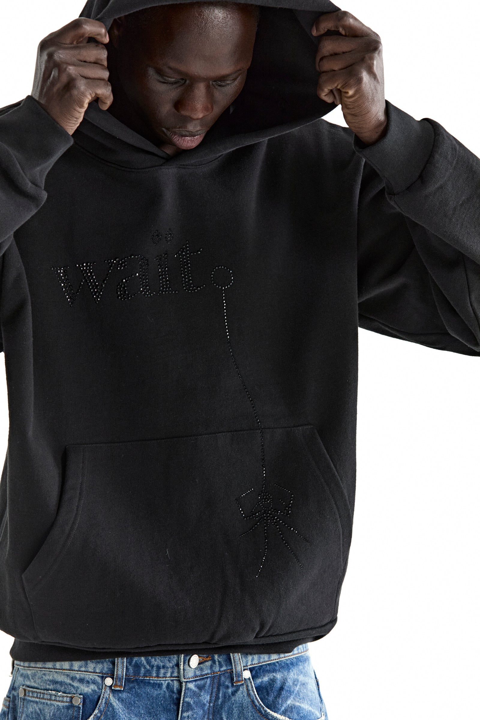 Black 13oz cotton fleece WAIT STONE HOODIE with rhinestone "Wait" and spider graphic, kangaroo pocket.