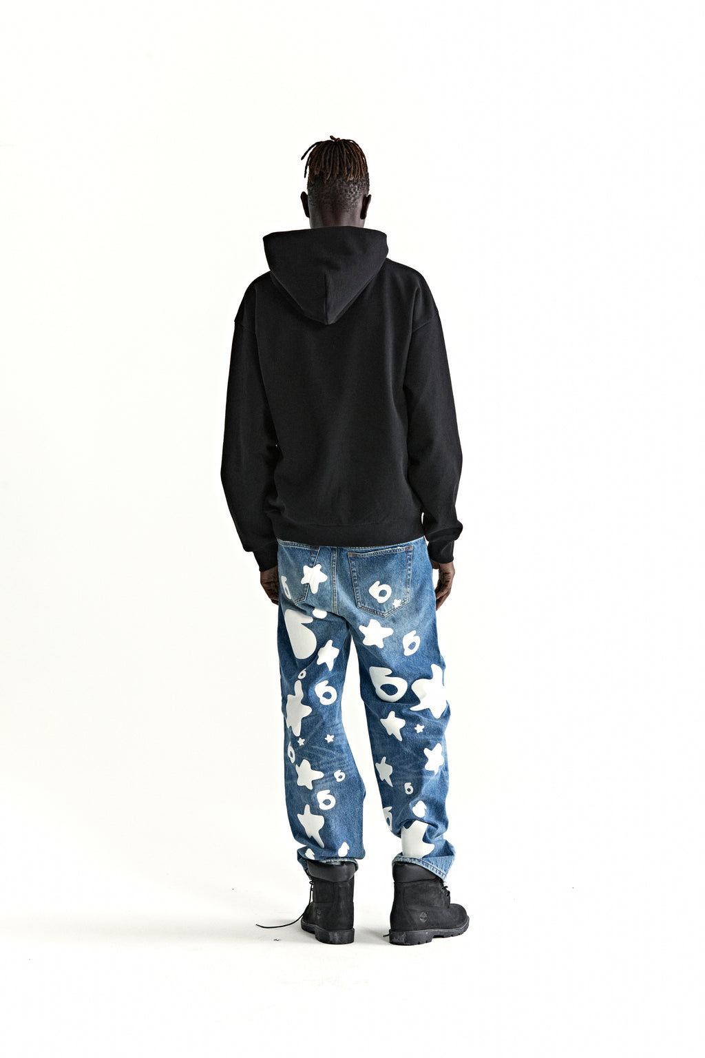 Black cotton fleece hoodie with rhinestone "Wait" detail, kangaroo pocket, rib knit hem and cuffs.