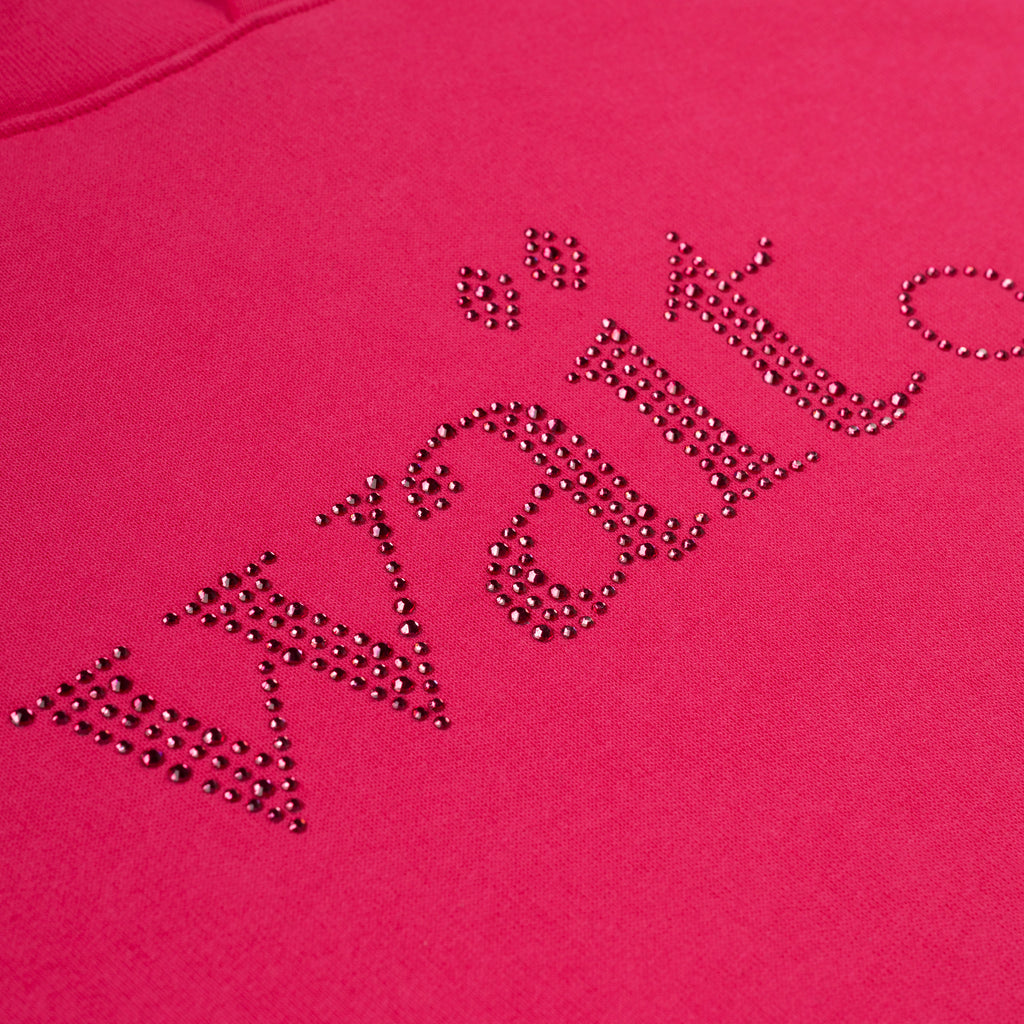 Close-up of a vibrant pink cotton fleece hoodie with "Wait" spelled in sparkling rhinestones.