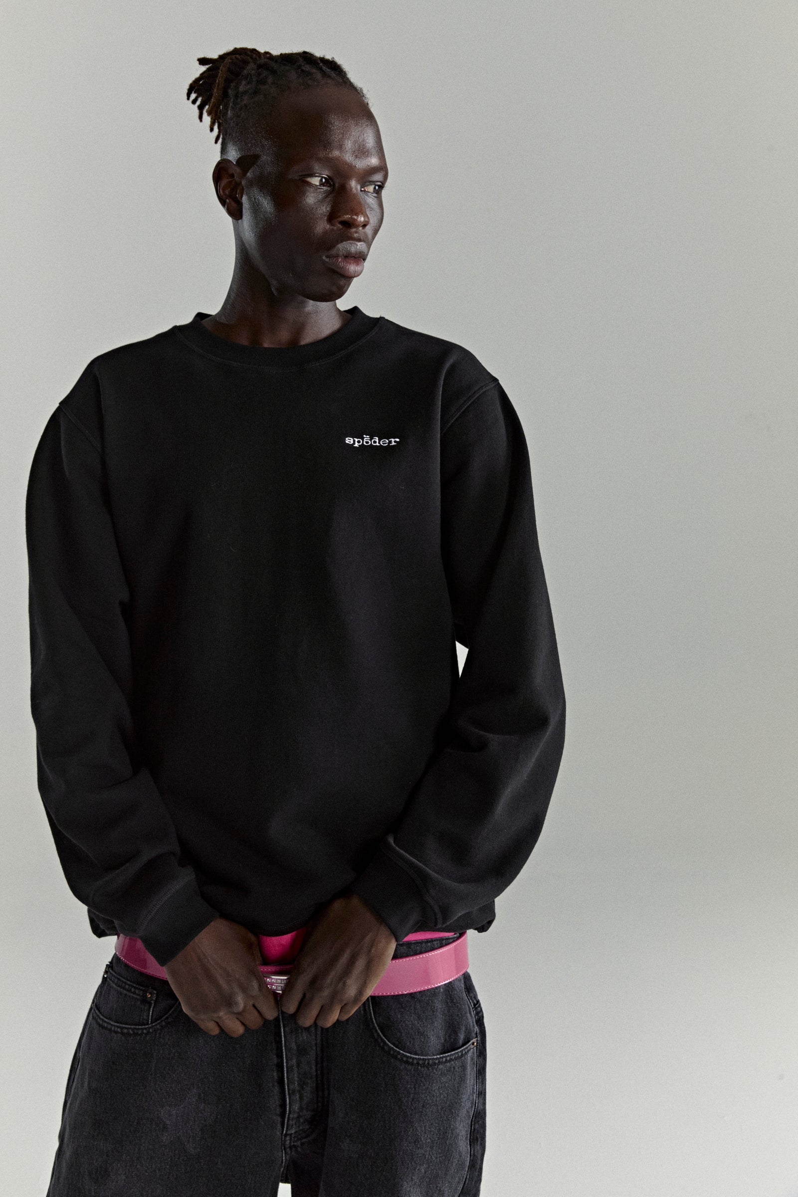 Black CORE CREWNECK sweatshirt with embroidered 'SP5DER' logo, ribbed collar, hem, and cuffs.
