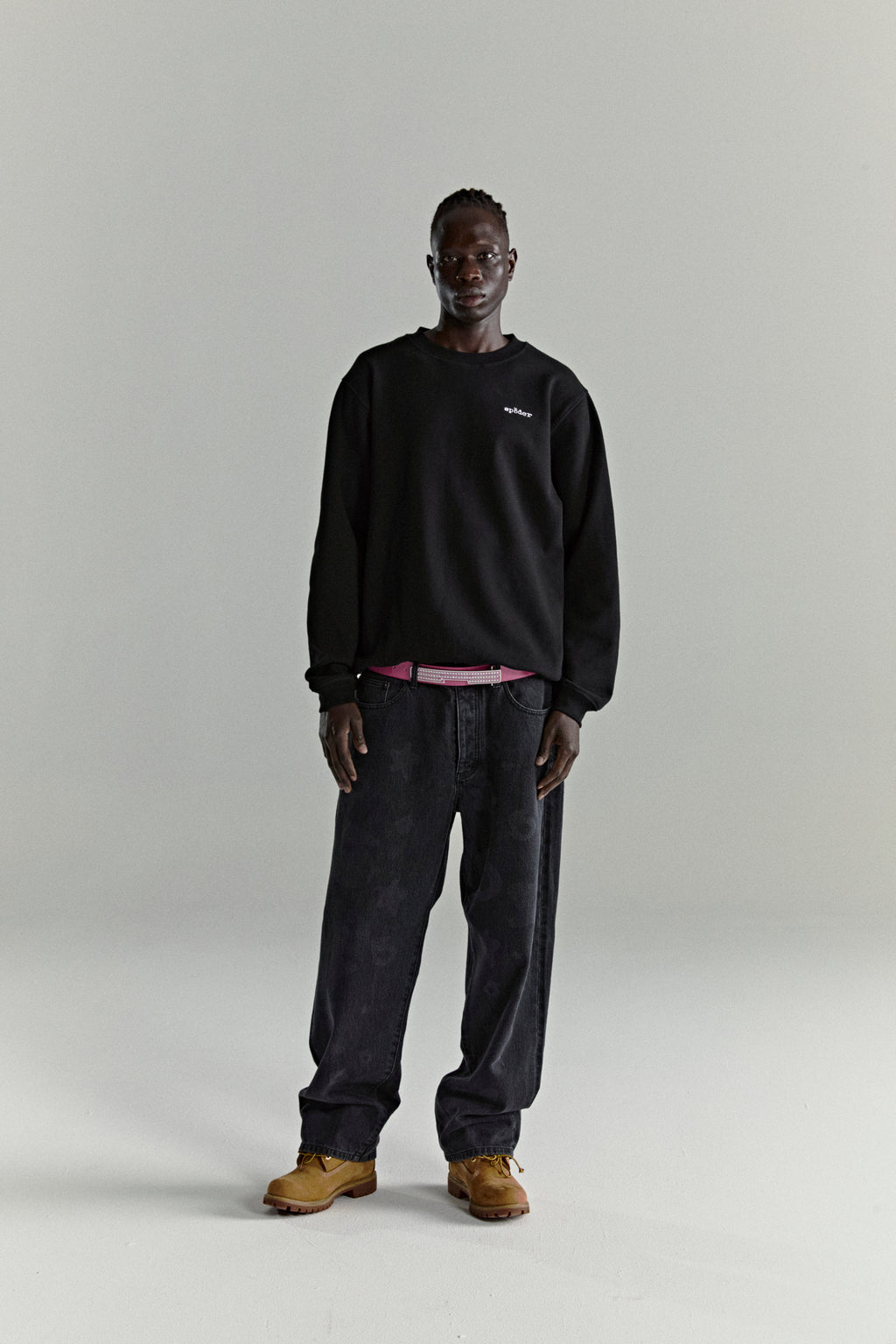 Black CORE CREWNECK, 13oz brushed fleece, with embroidered 'SP5DER' logo, worn by a model.