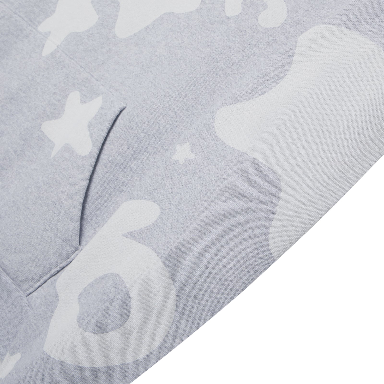 Close-up of a light grey Beluga V2 Hoodie, showing white puff print design, kangaroo pocket, and soft fleece texture.