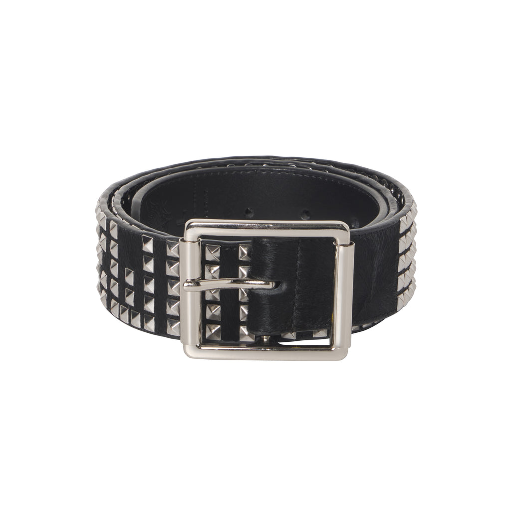 Black pony hair belt featuring silver-tone pyramid studs, a polished rectangular buckle, and an adjustable prong closure.