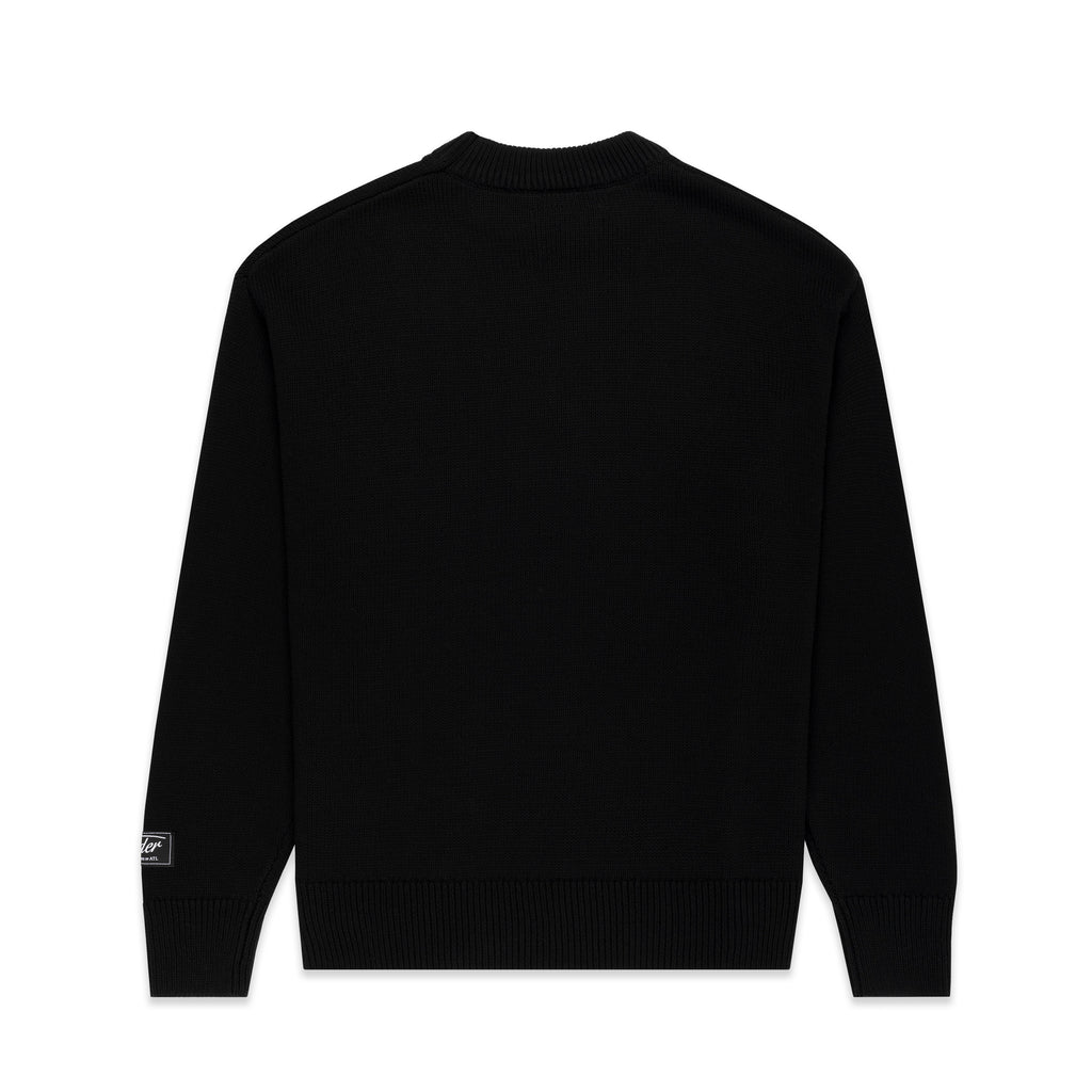 Black knitted sweater with ribbed collar, cuffs, hem, and branded sleeve patch.