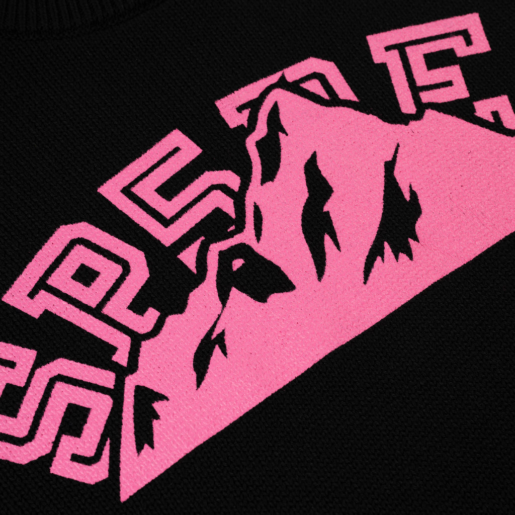 Black knitted sweater with a vibrant pink "SP5DER" mountain graphic.