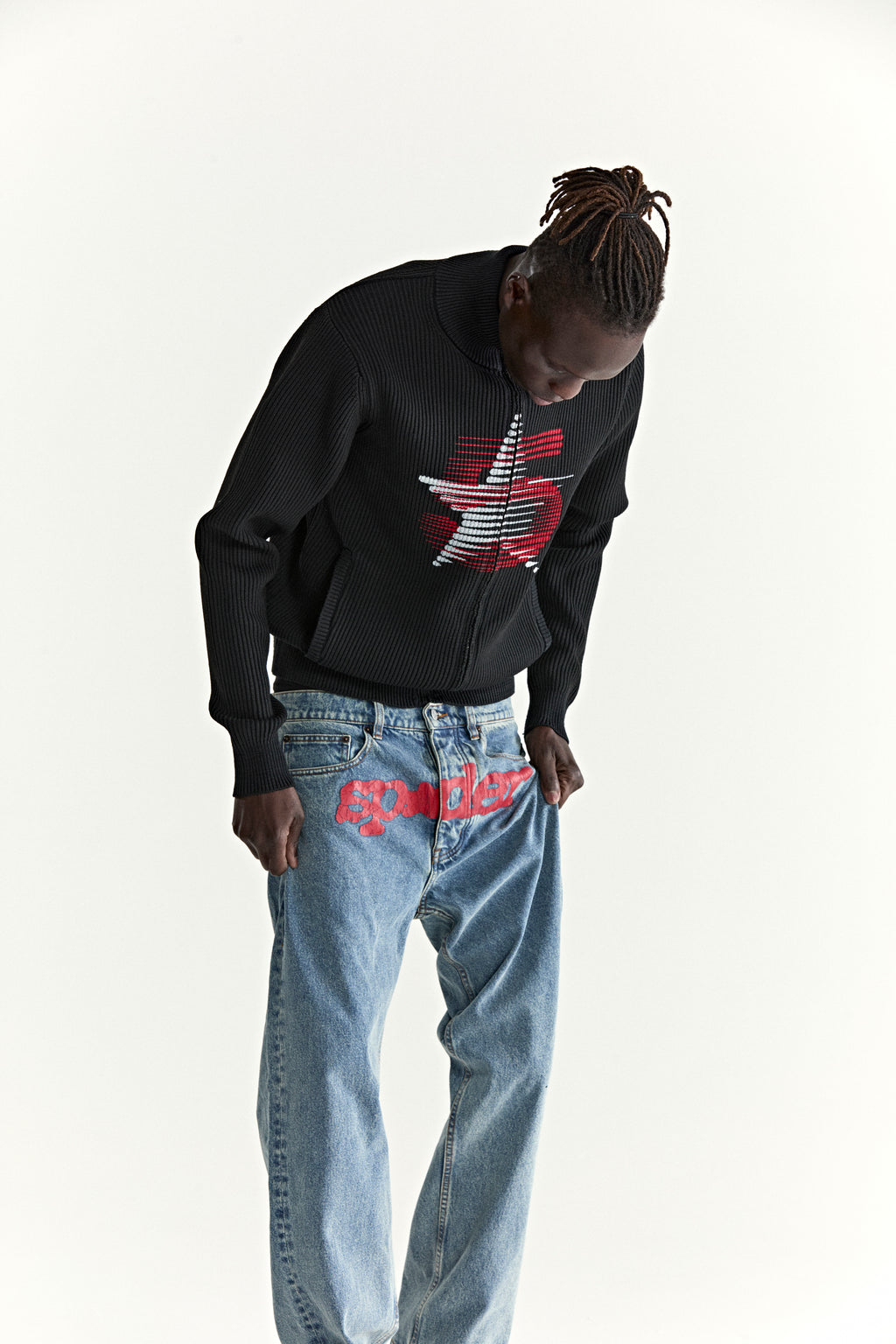 Black ribbed wool/cotton blend zip sweater with a red and white star graphic at the chest.