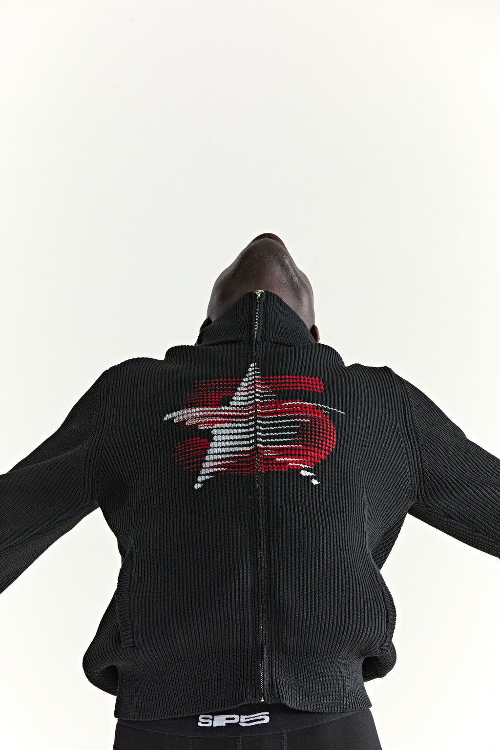 Black rib knit wool/cotton zip sweater with stand collar and red/white 5-star chest graphic.