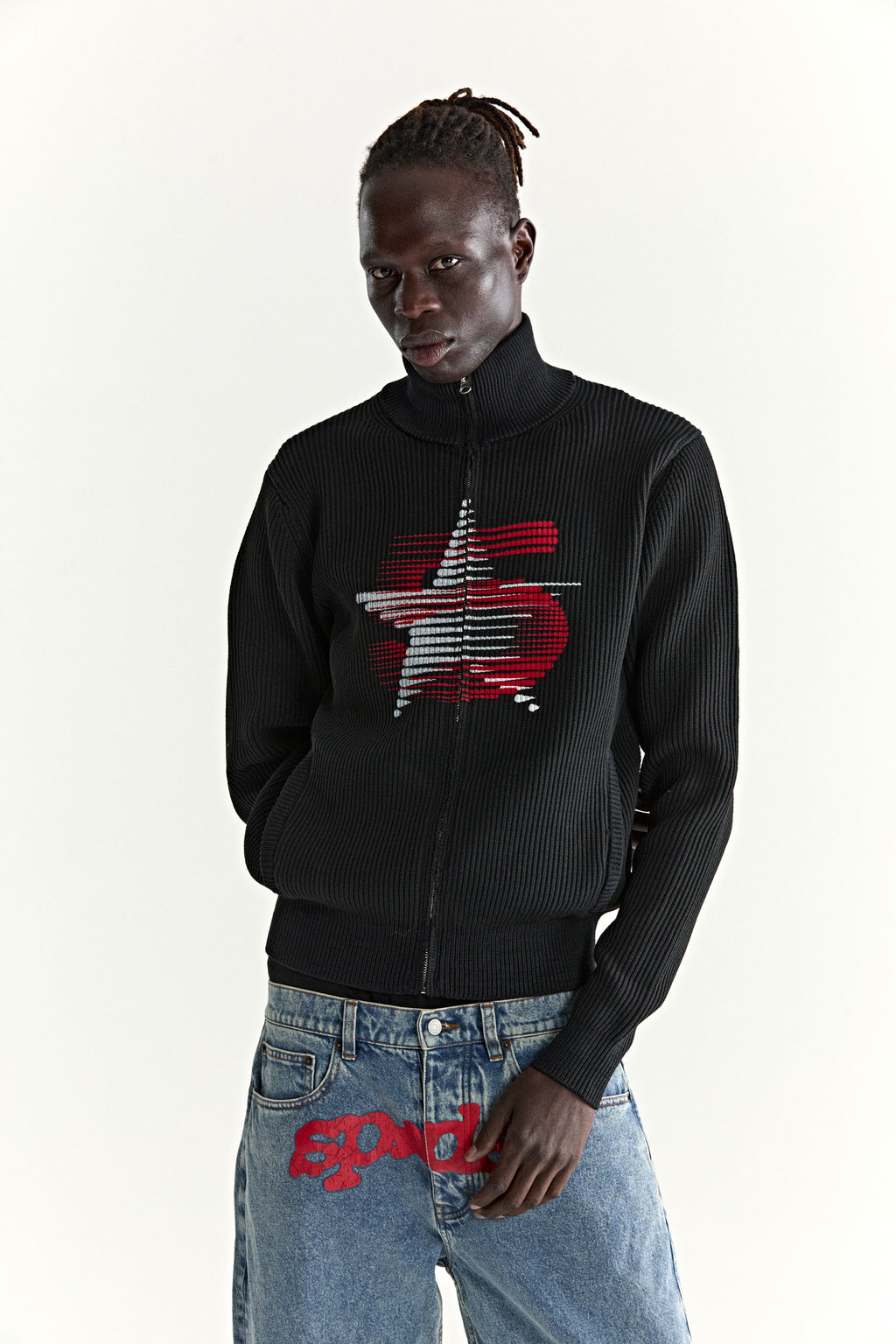 Black rib knit wool/cotton zip sweater with stand collar and red/grey star graphic.