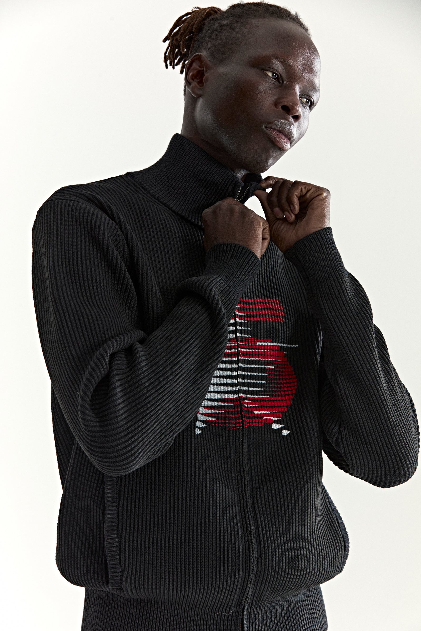 Black ribbed wool/cotton zip sweater with stand collar and red graphic "5" at chest.