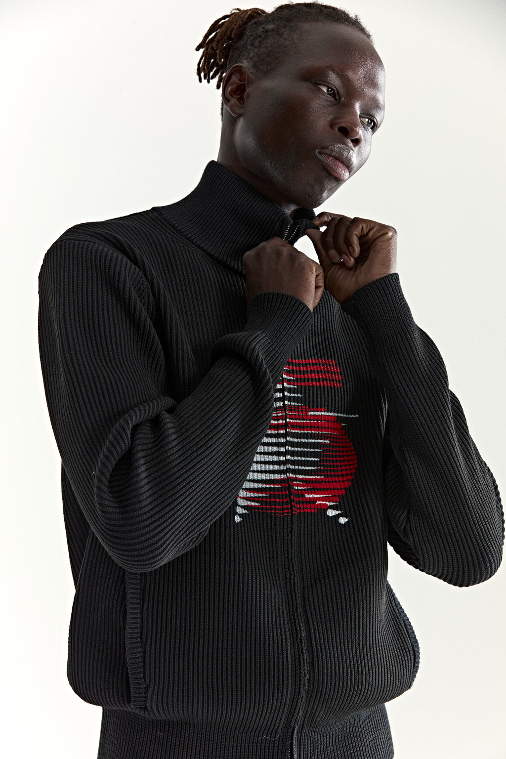 Black ribbed wool/cotton zip sweater with stand collar and red graphic "5" at chest.