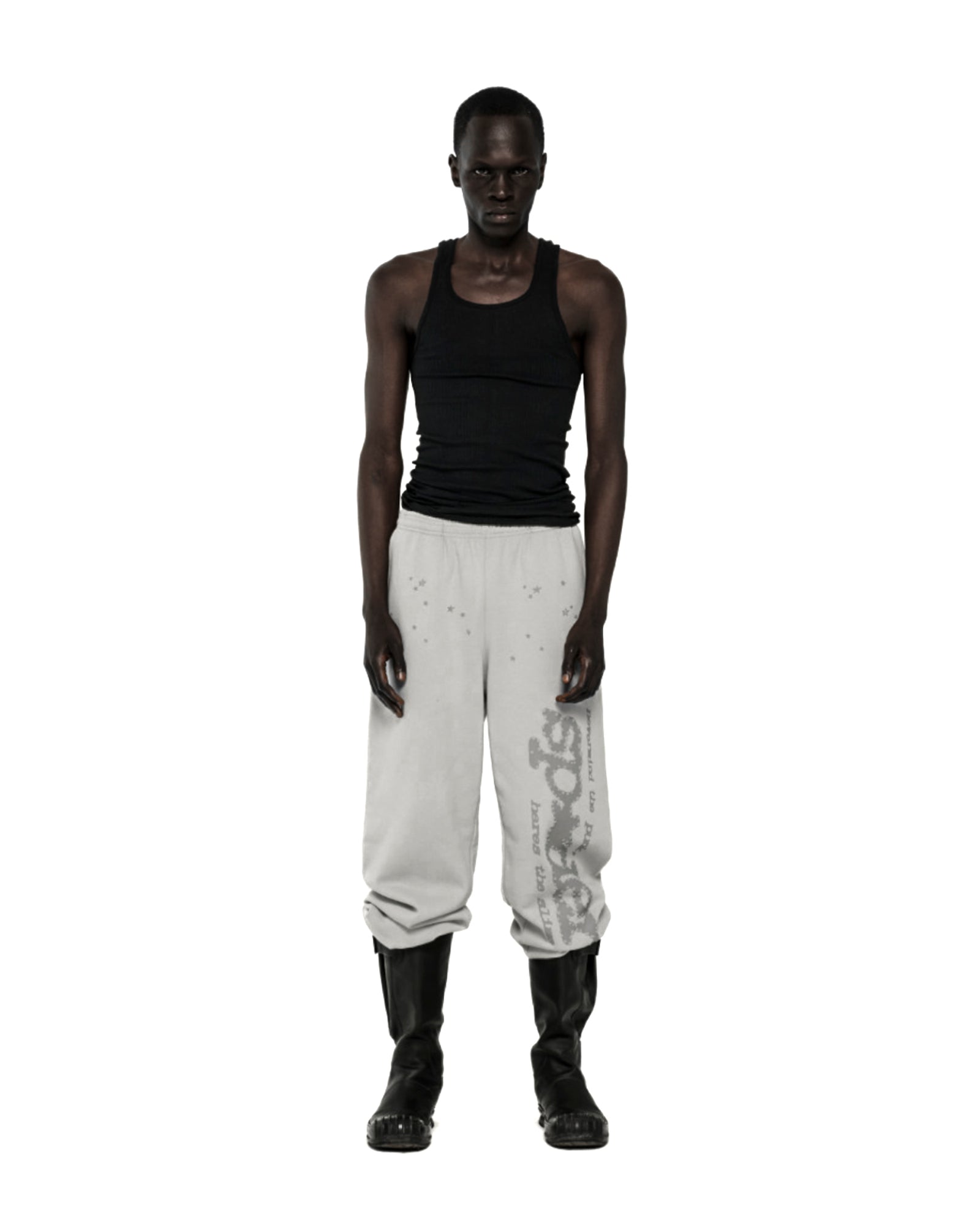 Light gray cotton fleece sweatpants with "P*NK SP5DER" text and star print, worn by a model.