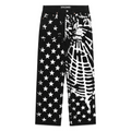 Black denim pants with white stars and web graphic print, five-pocket styling.