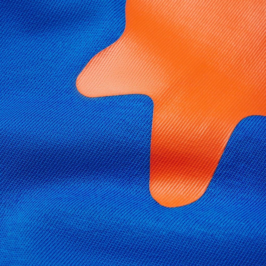 Blue 100% cotton tee featuring a vibrant orange plastisol graphic print with a smooth, textured finish.
