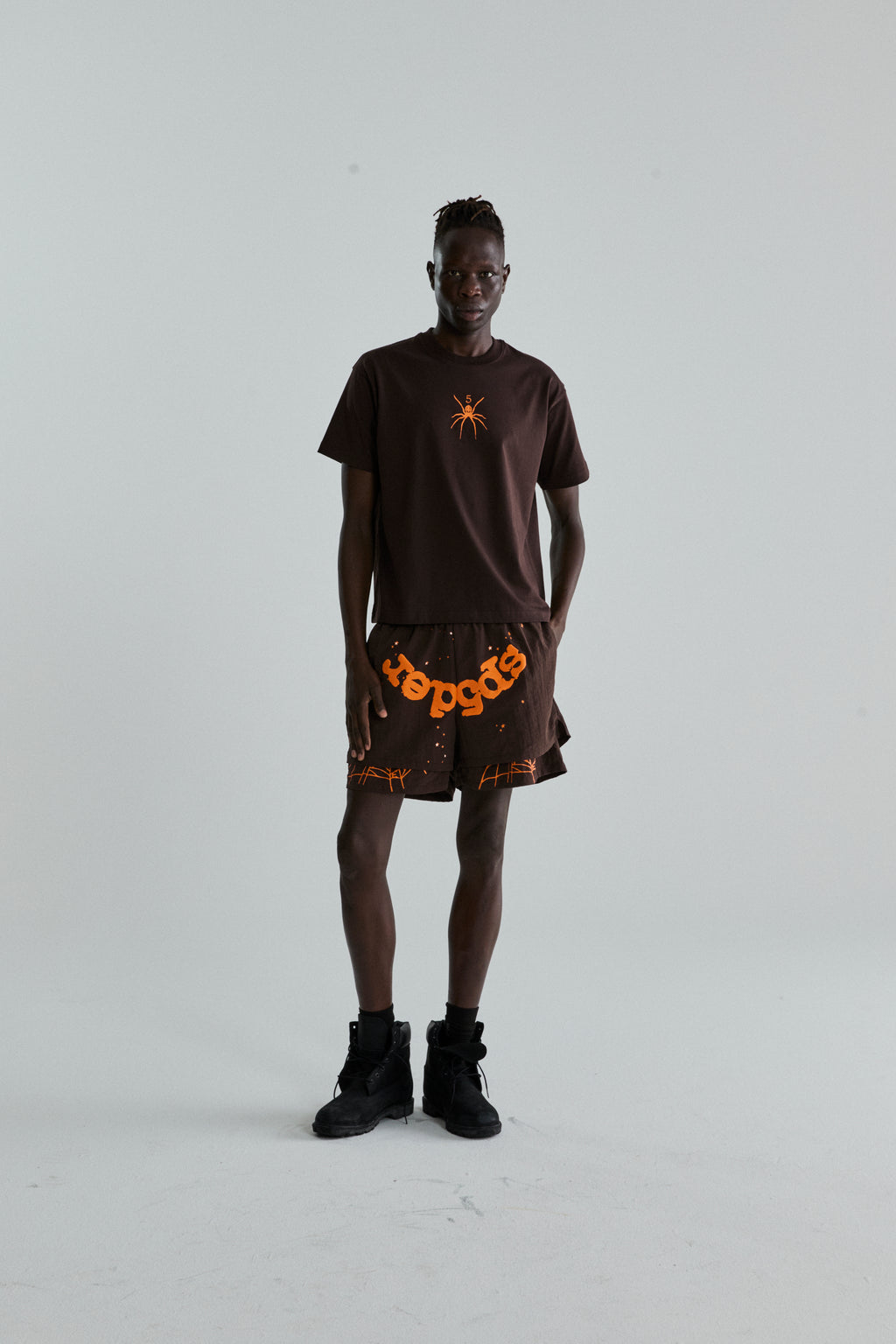 BROWN TM TEE ON MODEL