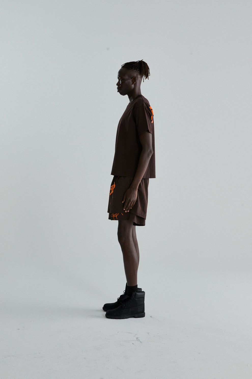 BROWN TM TEE ON MODEL