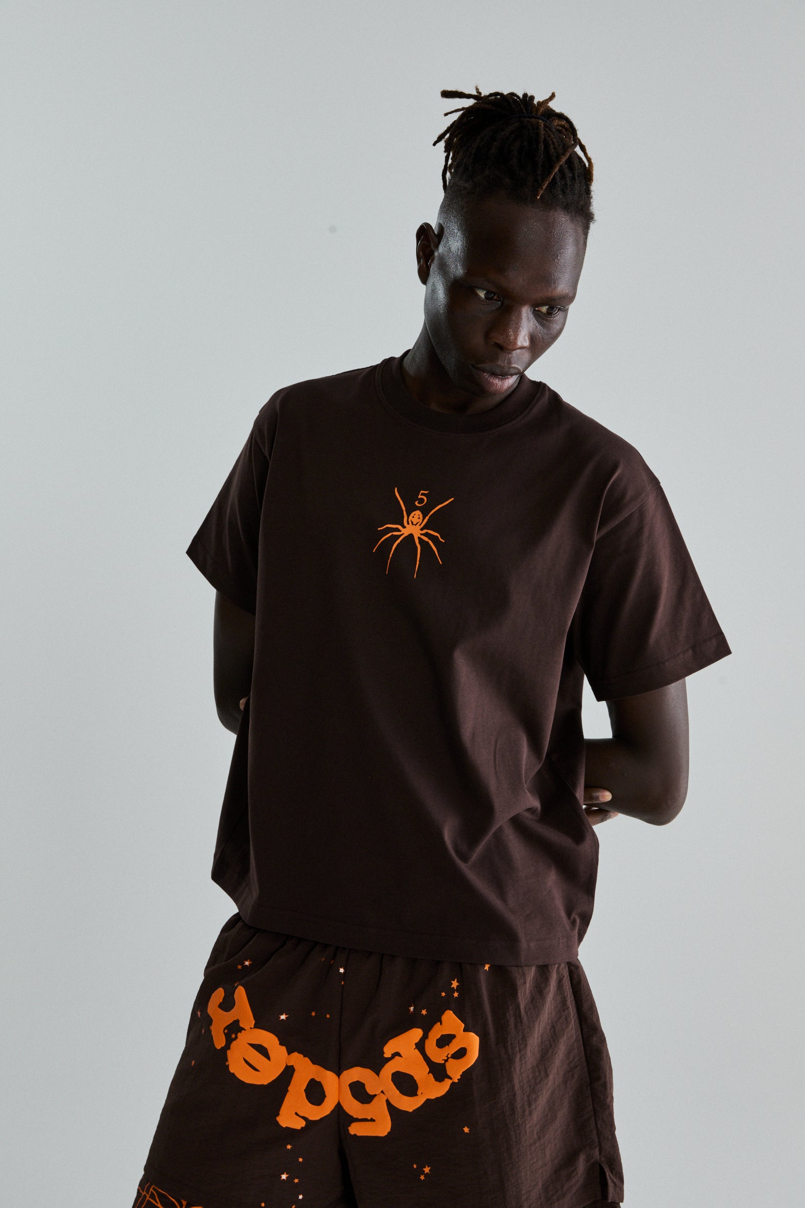 BROWN TM TEE ON MODEL