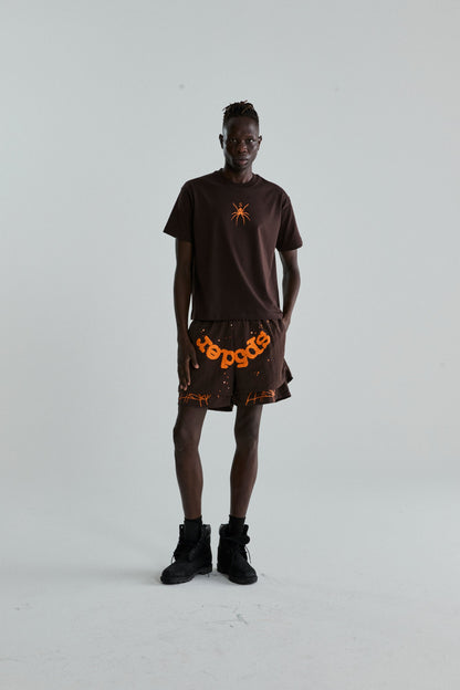 BROWN TM TEE ON MODEL