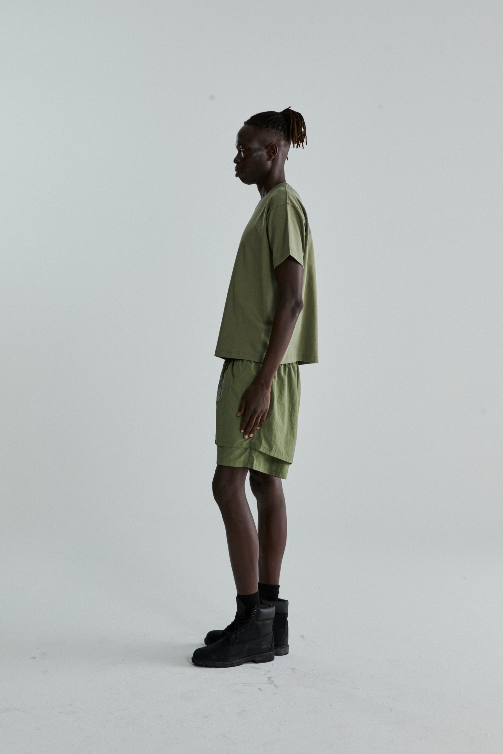 SAGE GREEN TM TEE ON MODEL