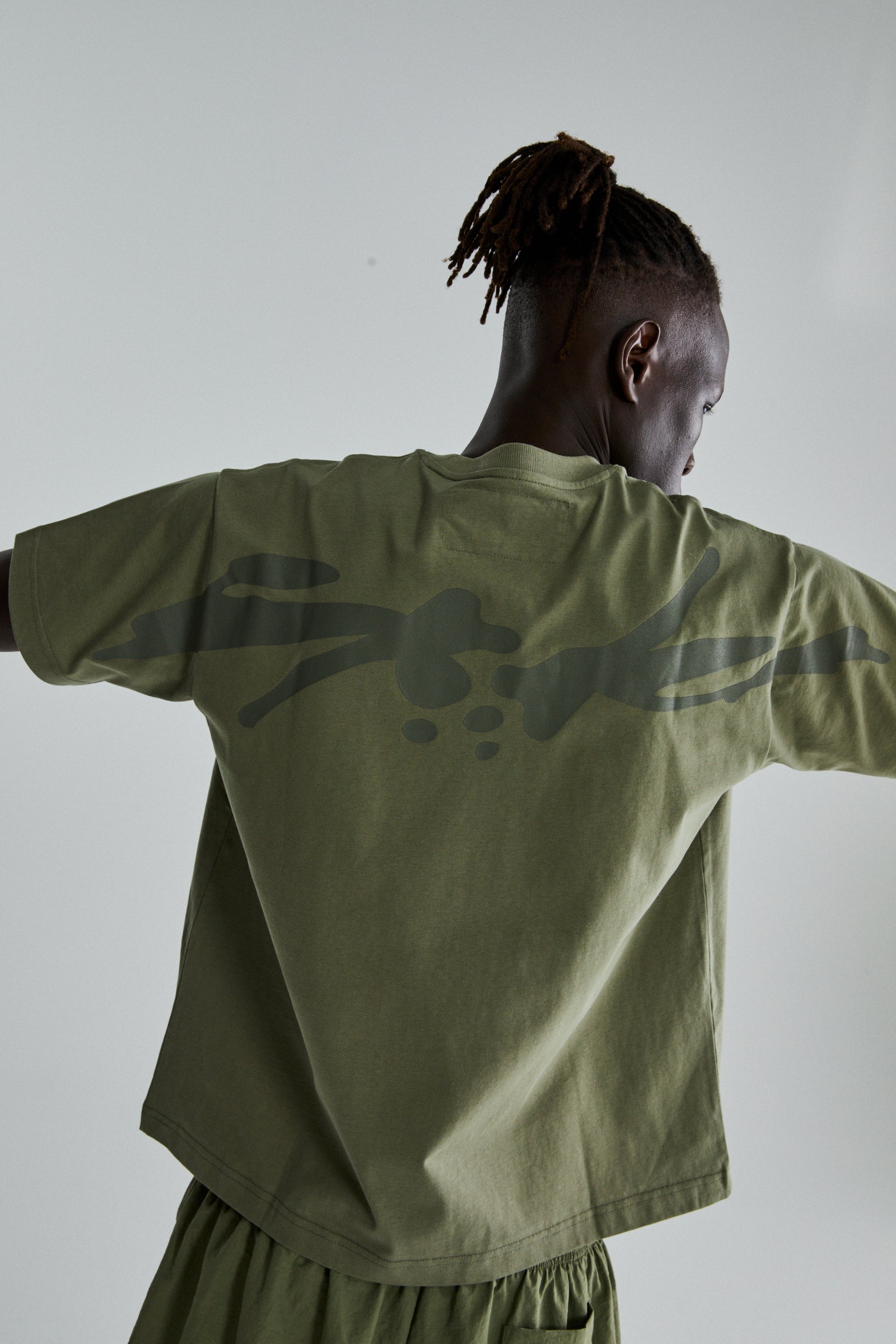 SAGE GREEN TM TEE ON MODEL