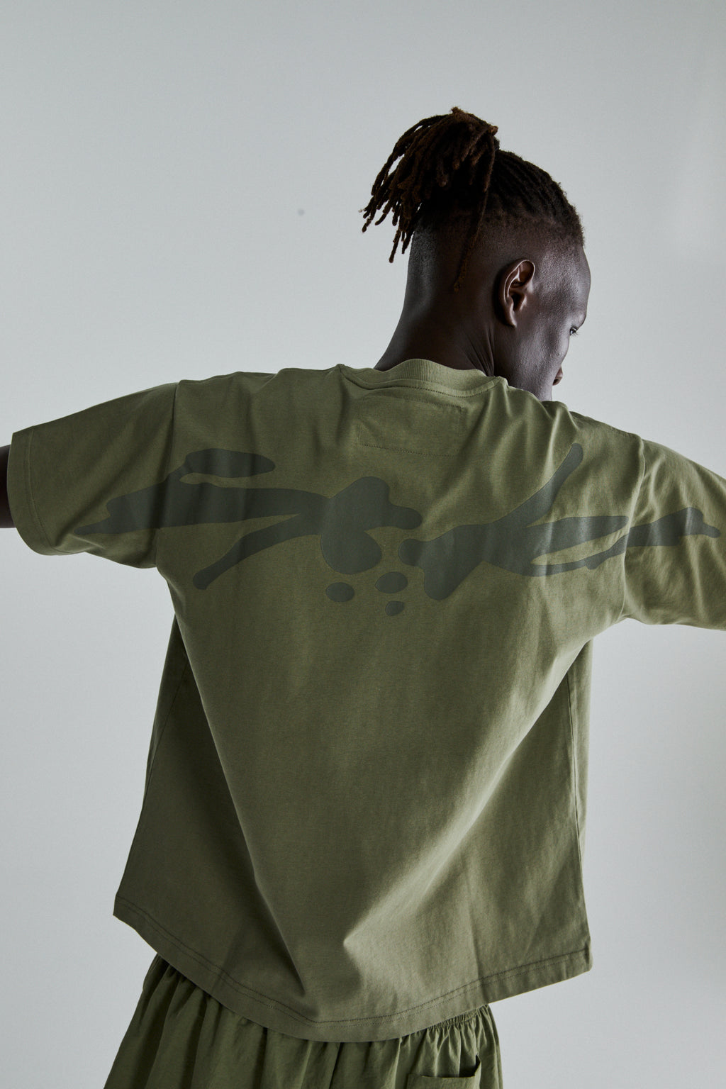 SAGE GREEN TM TEE ON MODEL