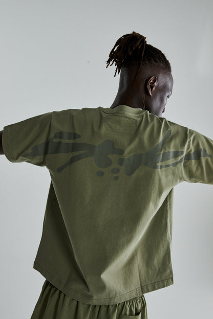 SAGE GREEN TM TEE ON MODEL