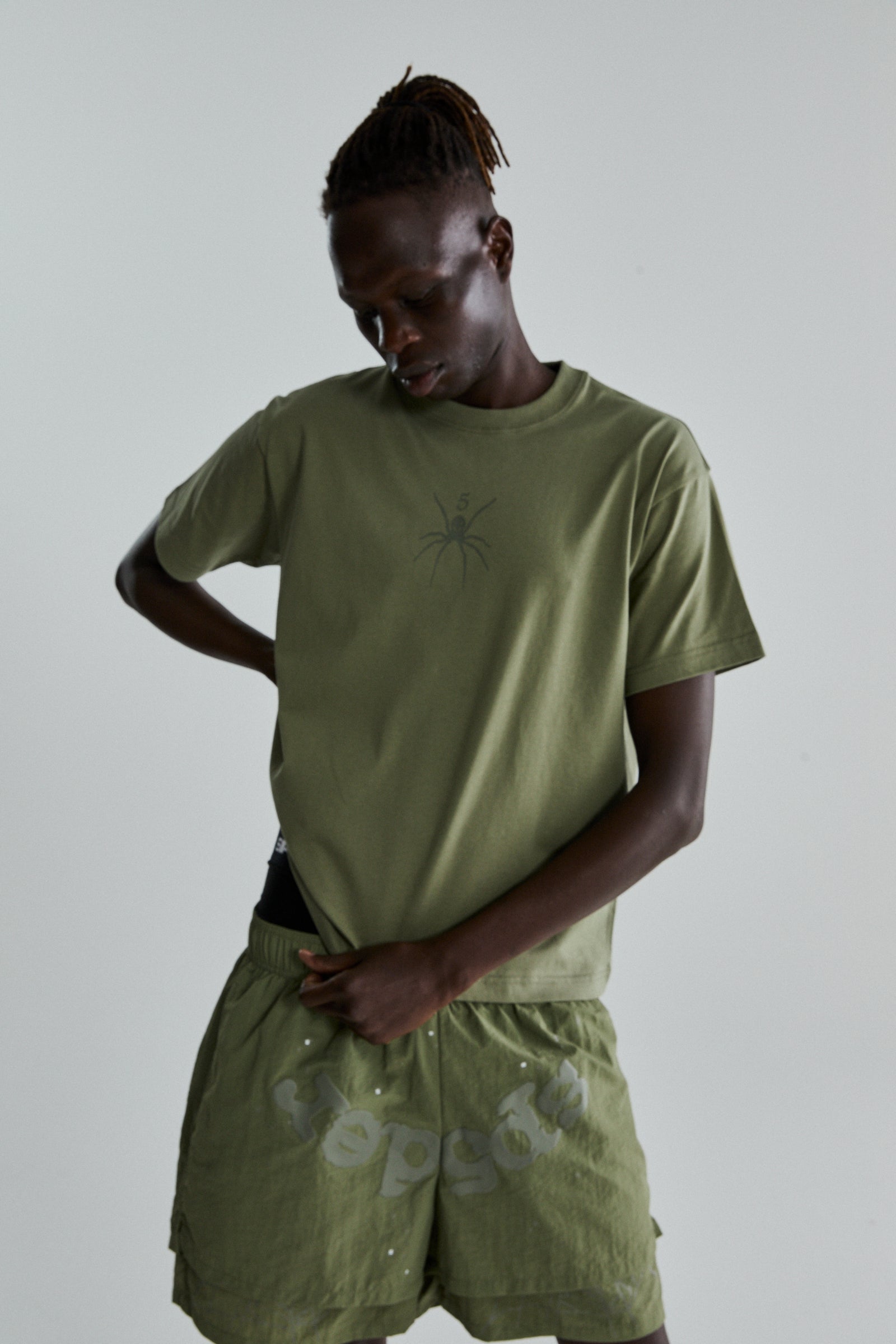 SAGE GREEN TM TEE ON MODEL