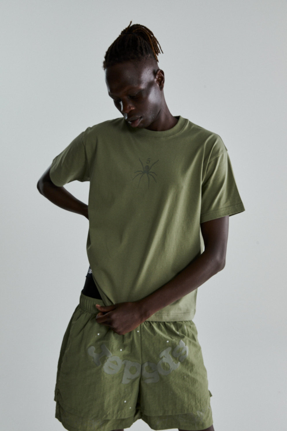 SAGE GREEN TM TEE ON MODEL