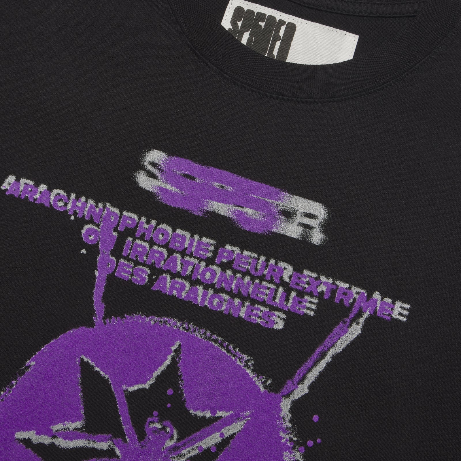 Black cotton tee with purple and white "ARACHNOPHOBIE" graphic print and star design.