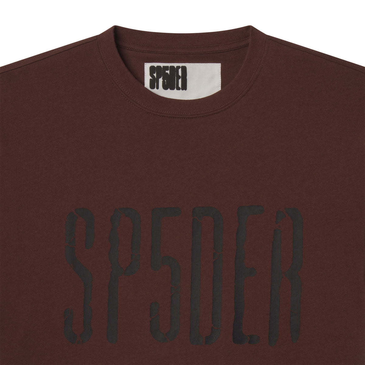 Brown 100% cotton standard fit tee featuring a black cracked graphic print logo on the front and an inner neck label.