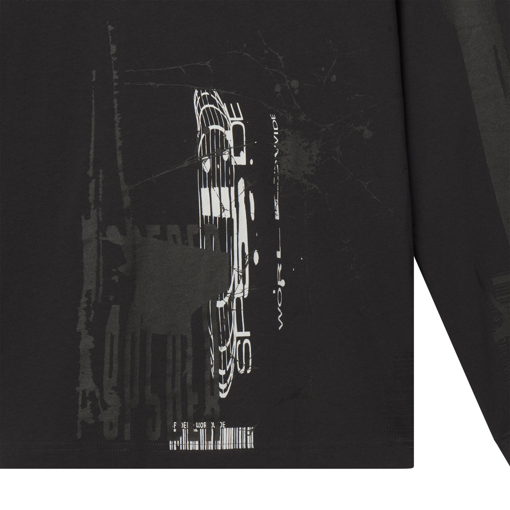 Black 100% cotton long sleeve tee featuring a white fragmented graphic print on the front and sleeves.