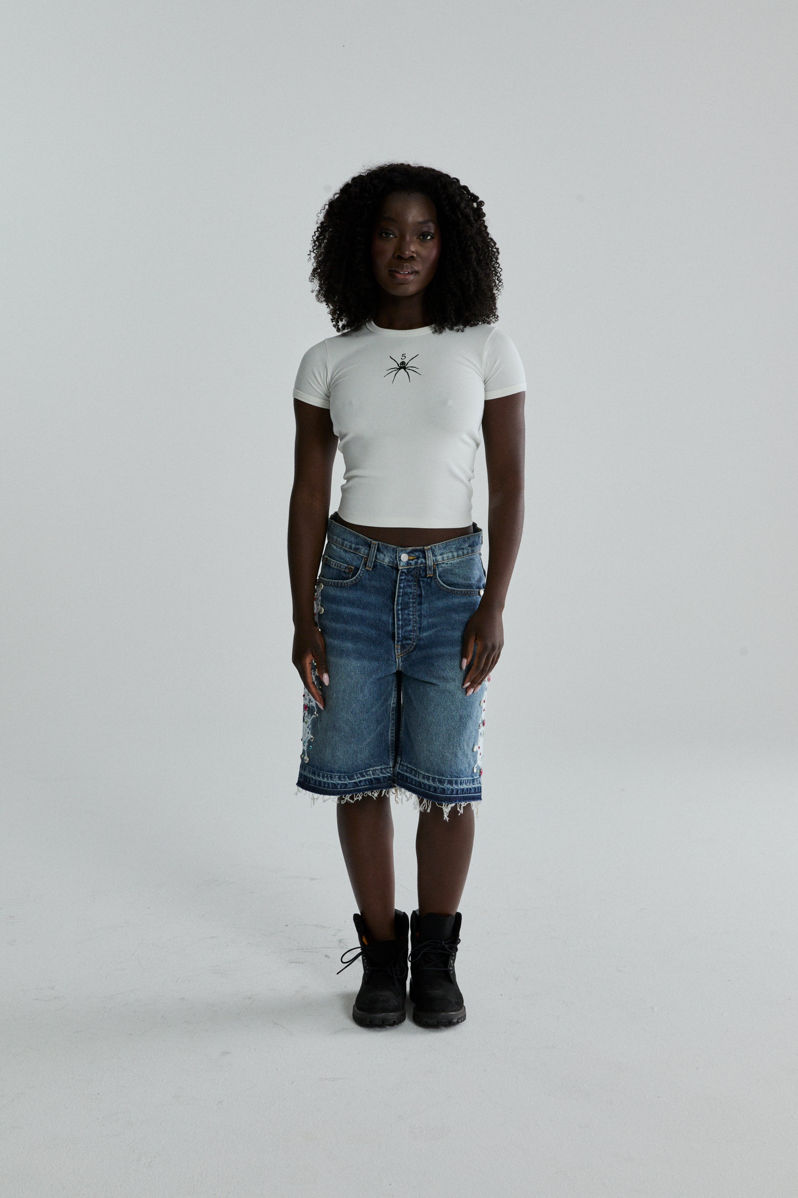 WHITE TM BABY TEE ON MODEL