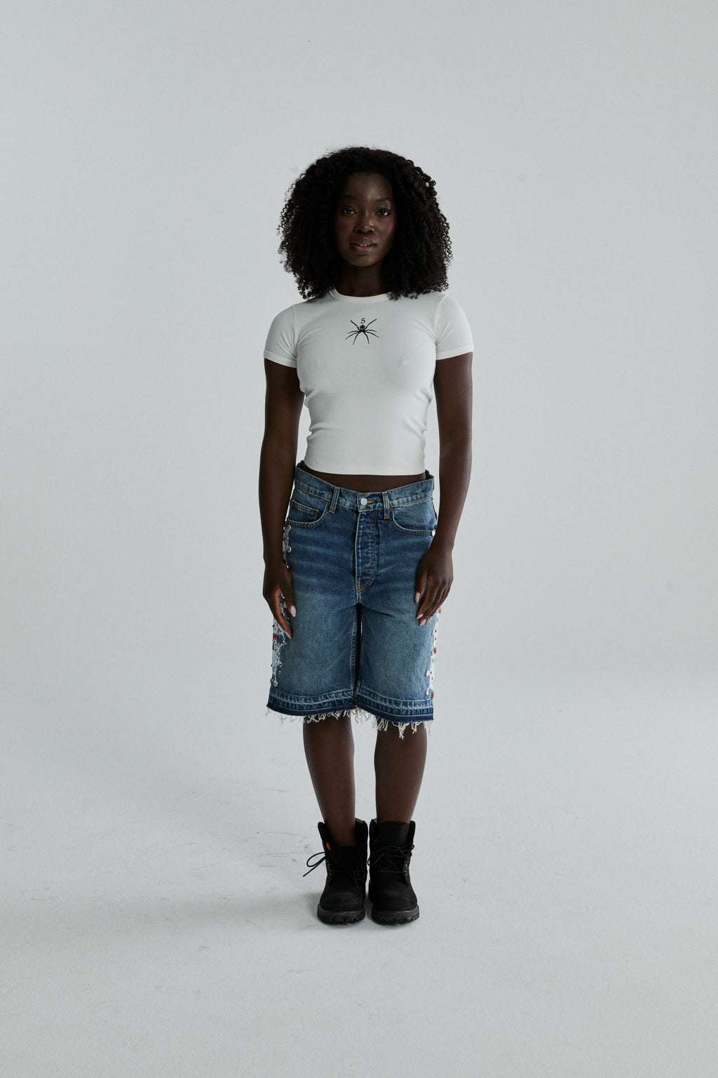 WHITE TM BABY TEE ON MODEL