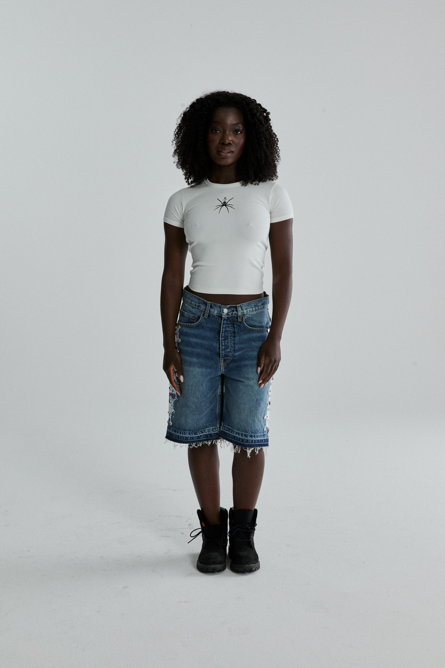 WHITE TM BABY TEE ON MODEL