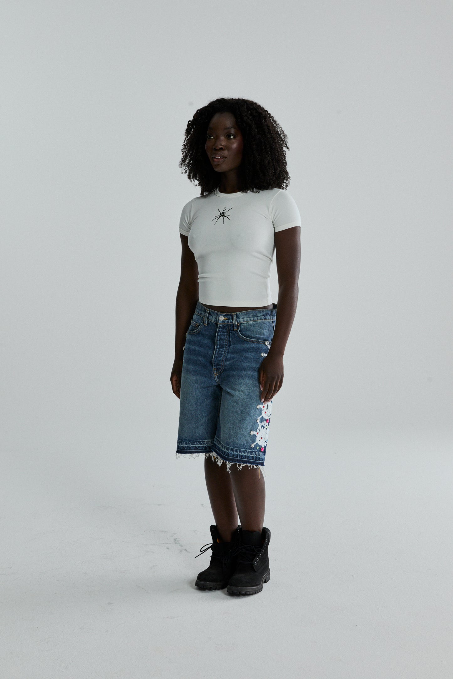 WHITE TM BABY TEE ON MODEL